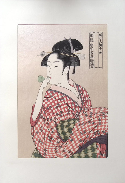 Utamaro, "A Woman playing a Poppin"